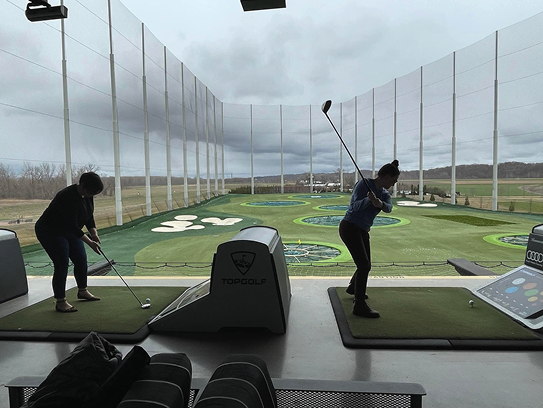 Hedy and Hopp at a golf event